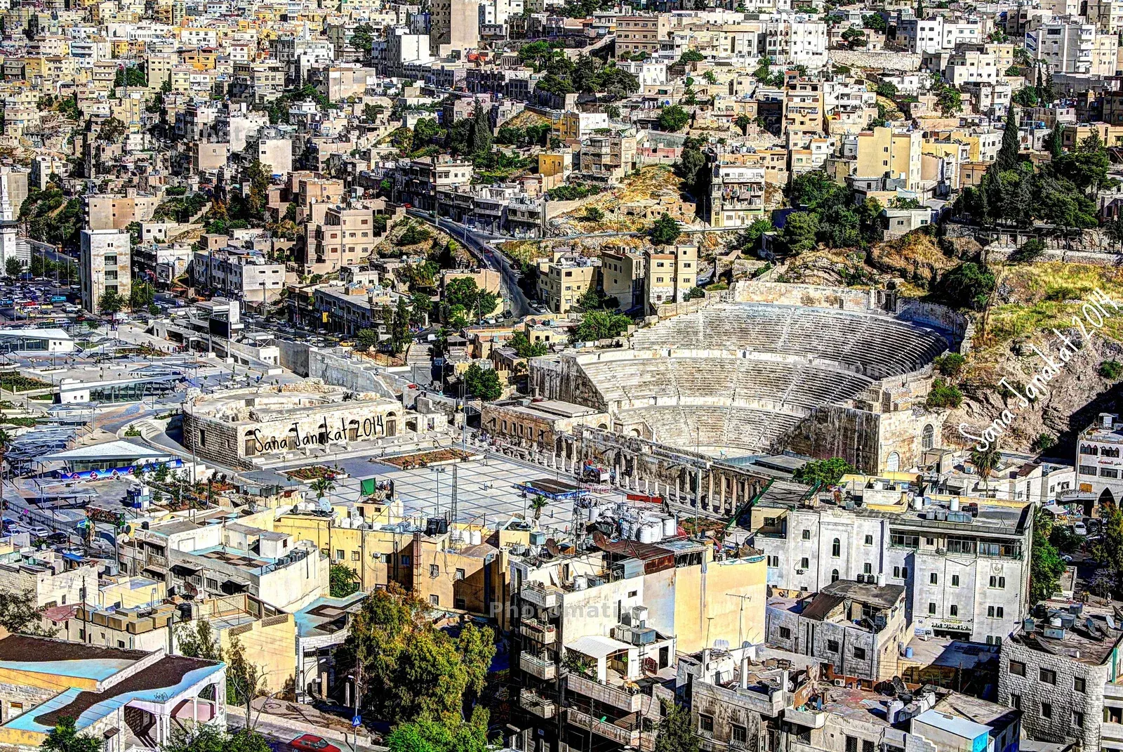 The Roman Theatre in downtown Amman seen from the Citadel, with hillside houses behind