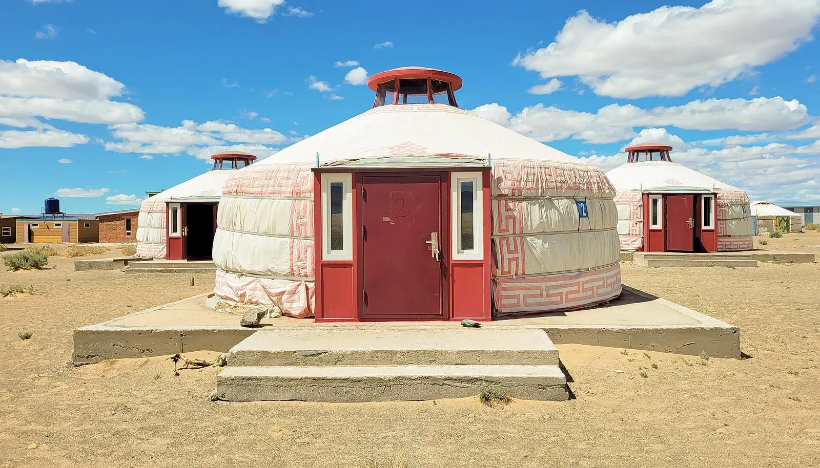 White ger tents at a tourist camp in the Gobi